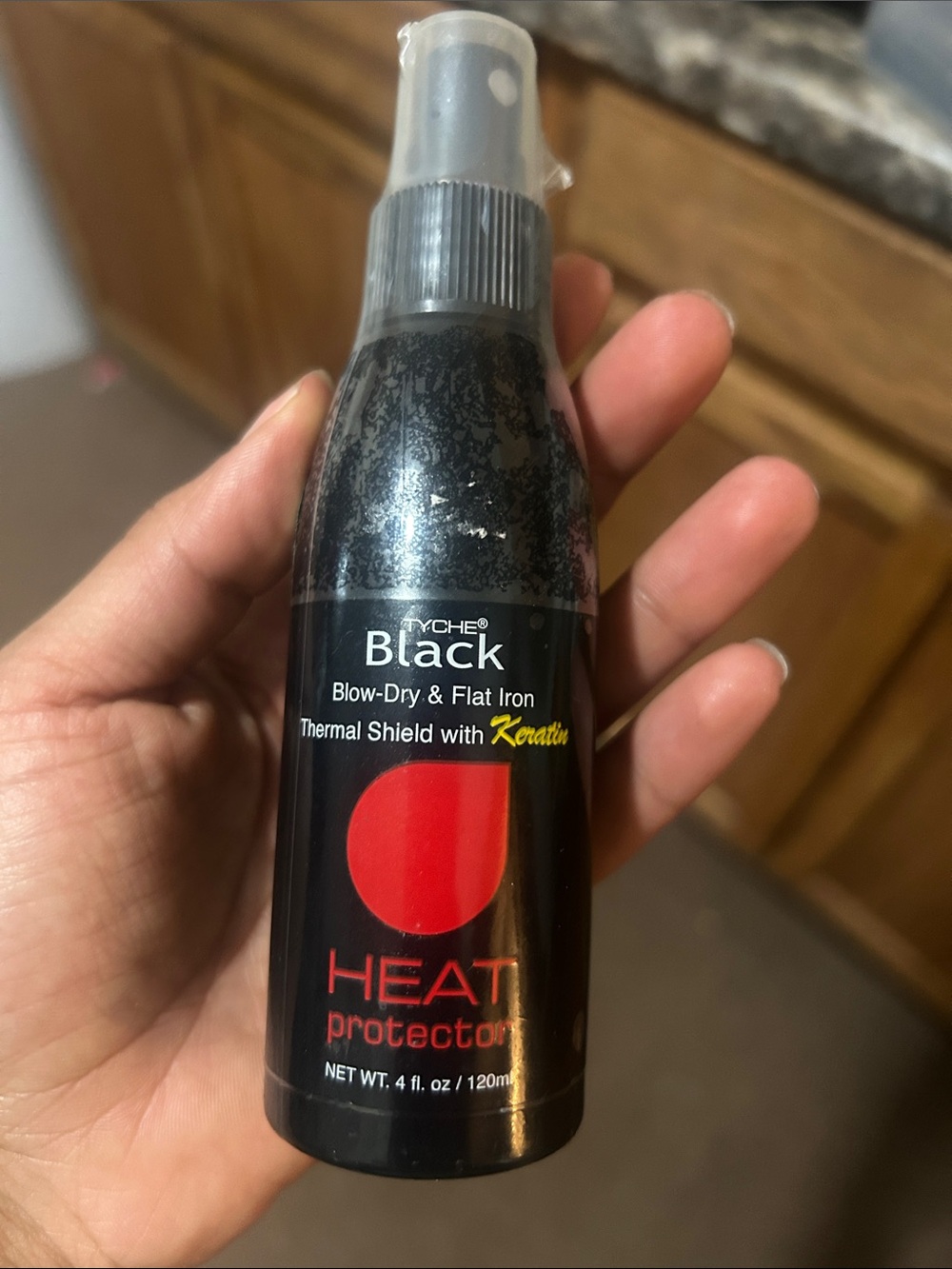 Tyche Black Heat Protector Spray - Black & Red Accent